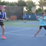 Junior tennis players double up to raise money