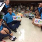 Cayman Prep donates books to LIFE